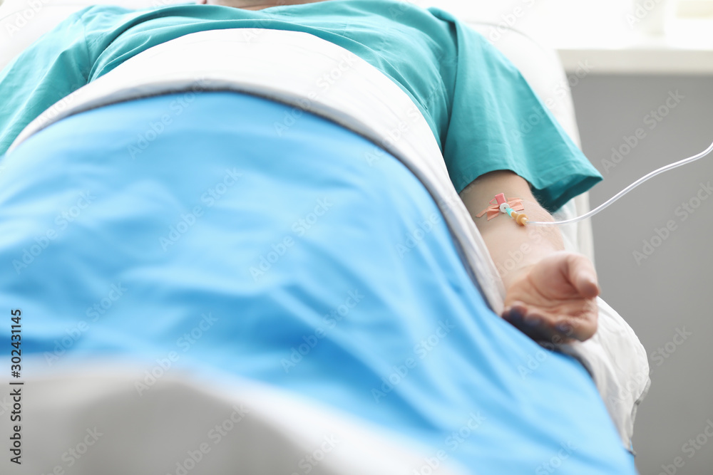 Fototapeta premium Man with IV in hospital