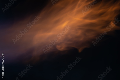 Soft blur flame with soft detail moving around with some blue flame on black background. For overlay effect