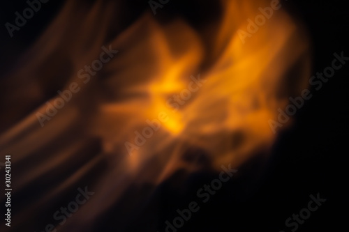 Soft blur flame with some detail on black background. For overlay effect