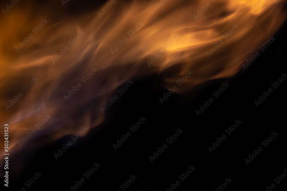 Soft blur flame from moving to the top with some blue flame on black background. For overlay effect