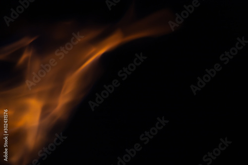 Soft blur flame with soft detail moving curve on black background. For overlay effect
