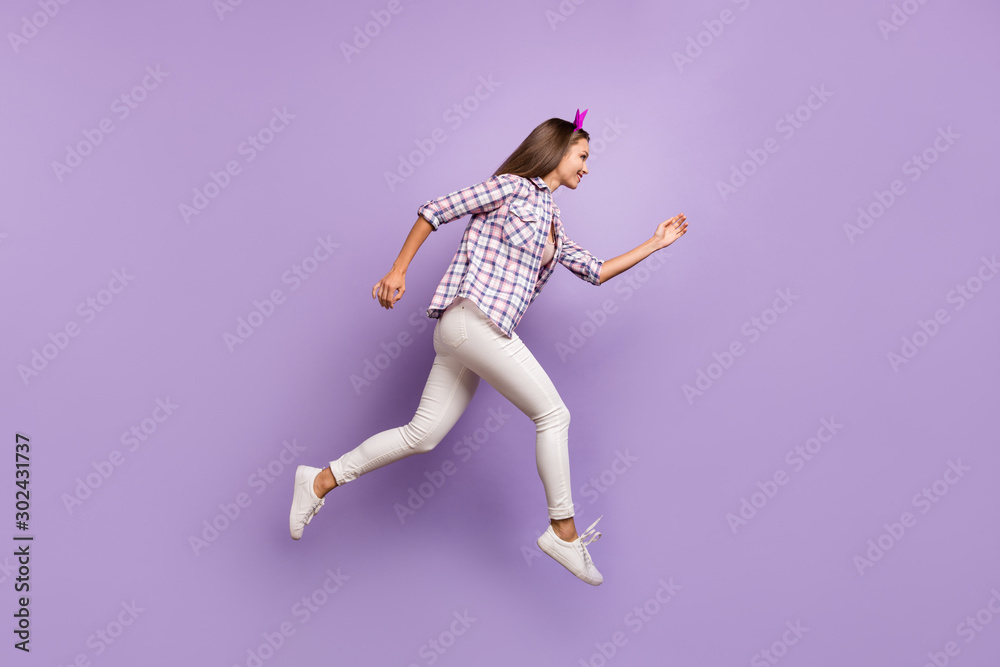 Full length body size profile side view of nice attractive lovely cheerful cheery strong sportive feminine girl running active life isolated on violet purple lilac pastel color background Full length body size profile side view of nice attractive lovely cheerful cheery strong sportive feminine girl running active life isolated on violet purple lilac pastel color background