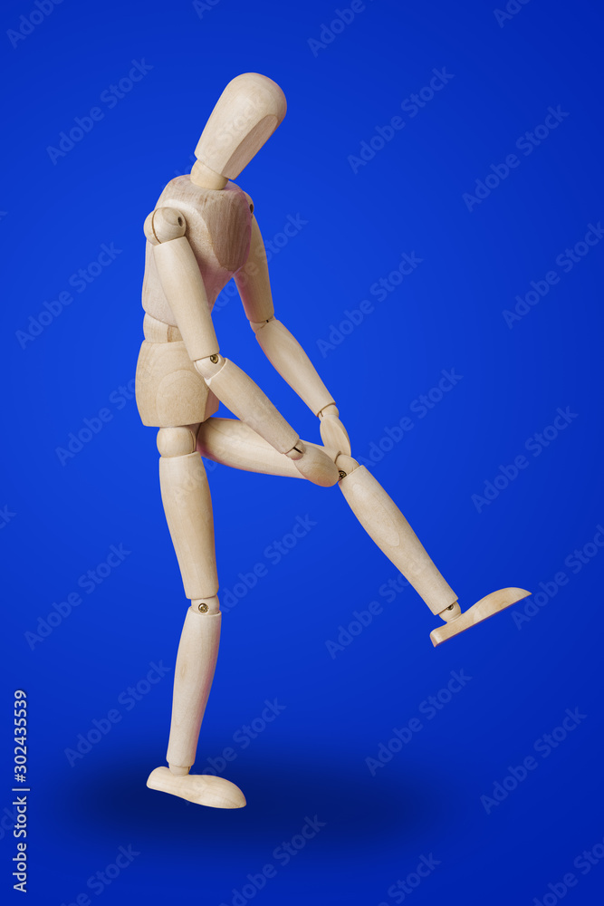 Wooden toy figure of patient - medical concept Wooden toy figure of patient - medical concept