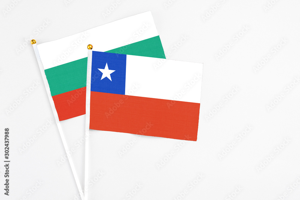 Chile and Bulgaria stick flags on white background. High quality fabric, miniature national flag. Peaceful global concept.White floor for copy space. Chile and Bulgaria stick flags on white background. High quality fabric, miniature national flag. Peaceful global concept.White floor for copy space.