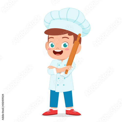 happy cute kid boy in chef costume