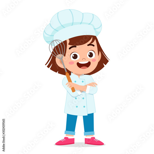 happy cute kid girl in chef costume