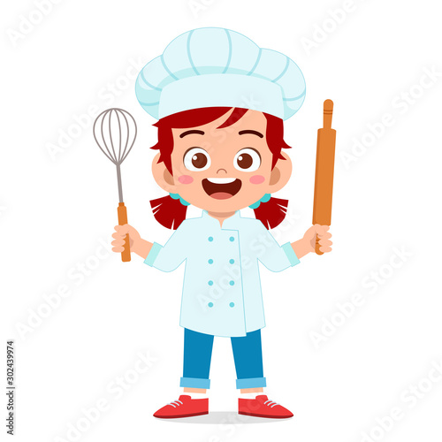 happy cute kid girl in chef costume