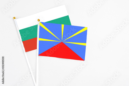 Reunion and Bulgaria stick flags on white background. High quality fabric, miniature national flag. Peaceful global concept.White floor for copy space. Free Download Reunion and Bulgaria stick flags on white background. High quality fabric, miniature national flag. Peaceful global concept.White floor for copy space. - GFXLoad