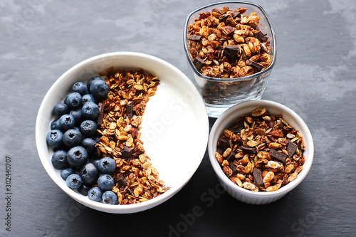 Bowl of homemade granola with yogurt and fresh berries