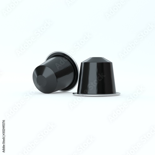 Two black espresso coffee capsules.