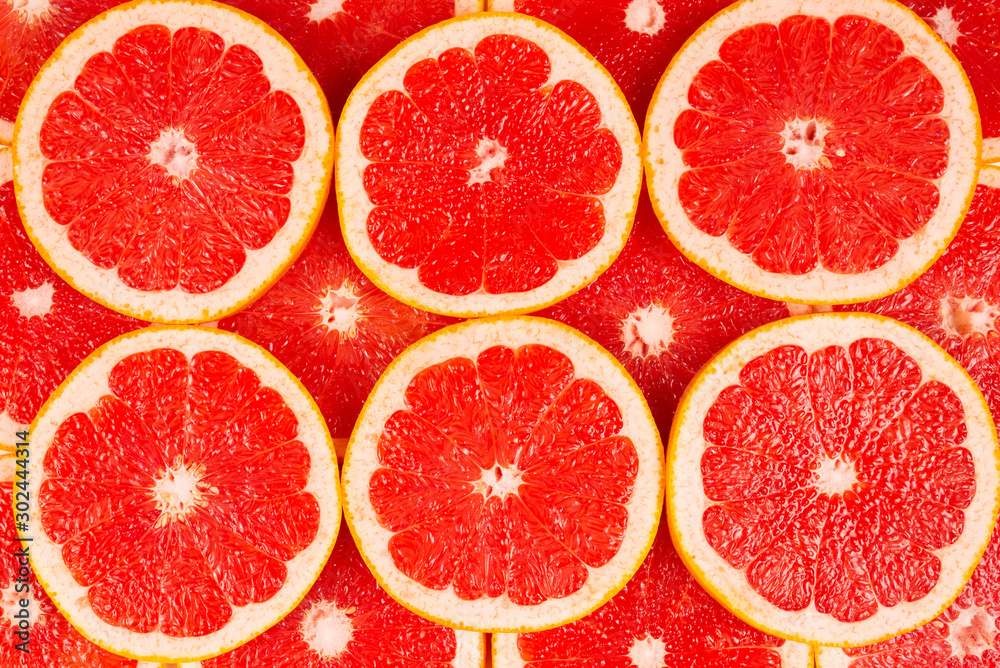 Grapefruit red juicy slices background. top view Grapefruit red juicy slices background. top view