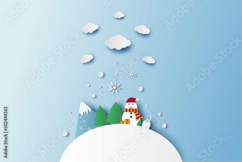 Snowman and winter landscape. Paper art vector illustration style.