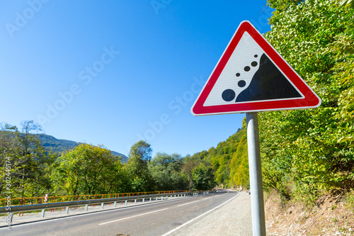 warning road sign - rockfall possible
