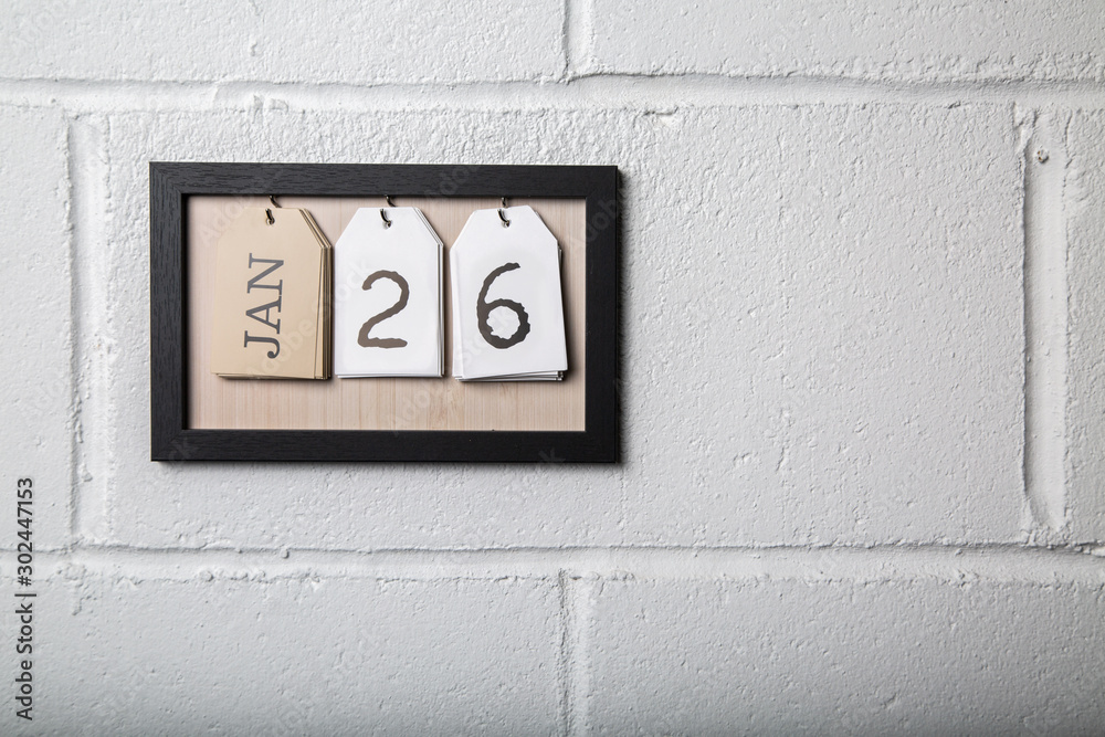 Wall Hanging Calendar in a Picture Frame Showing January 26 Wall Hanging Calendar in a Picture Frame Showing January 26