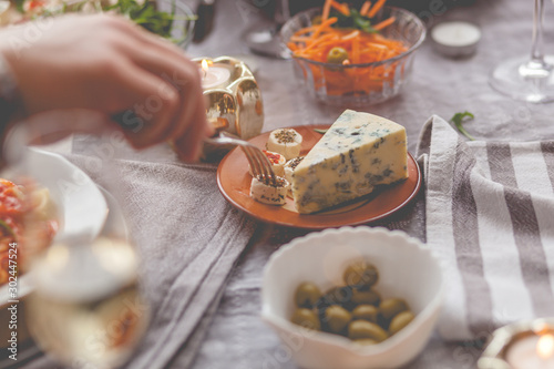 Close up of taking cheese from a plate.