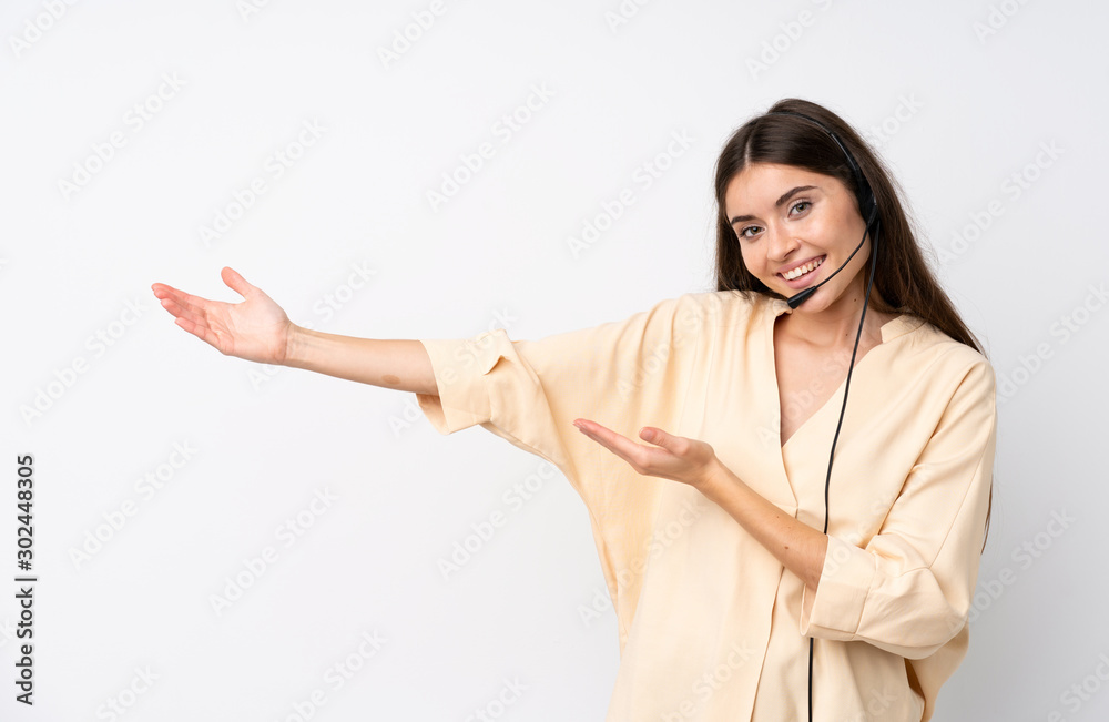 Young telemarketer woman over isolated white background extending hands to the side for inviting to come Young telemarketer woman over isolated white background extending hands to the side for inviting to come