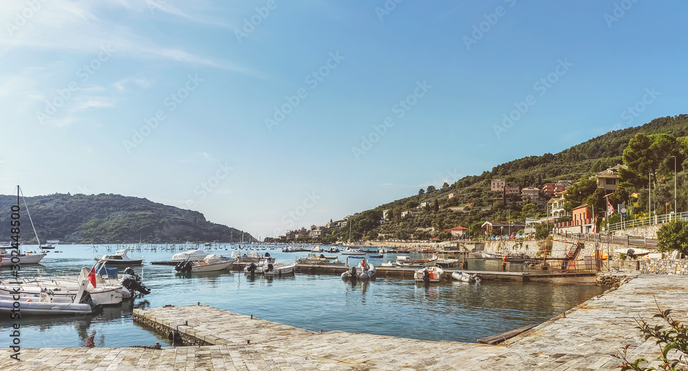Panoramic views of ships and boats in the harbor of the coastal village of Porto Venere, Italy, in the bay of poets in La Spezia along the Ligurian coast.
