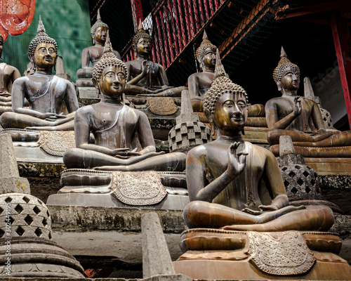 Lines of Bhudda statues at the  Gangaramaya Temple photo