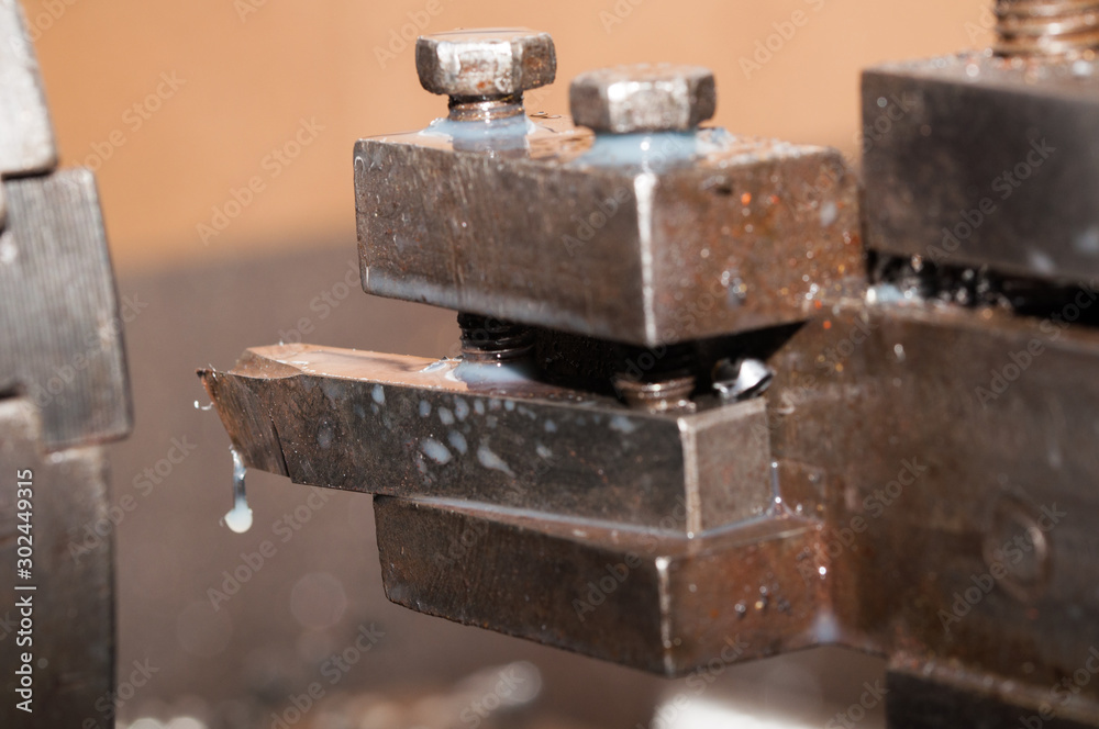 Metal processing by lathe machine. cutting tool at mechanical turning metal working Metal processing by lathe machine. cutting tool at mechanical turning metal working