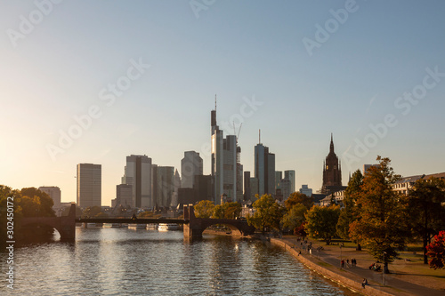 Visiting Frankfurt. View over the river Main to the city skyline. Skyline of Frankfurt am Main in the summer sunset  Germany. Frankfurt am Main  Germany. Cityscape image of Frankfurt am Main in sunset