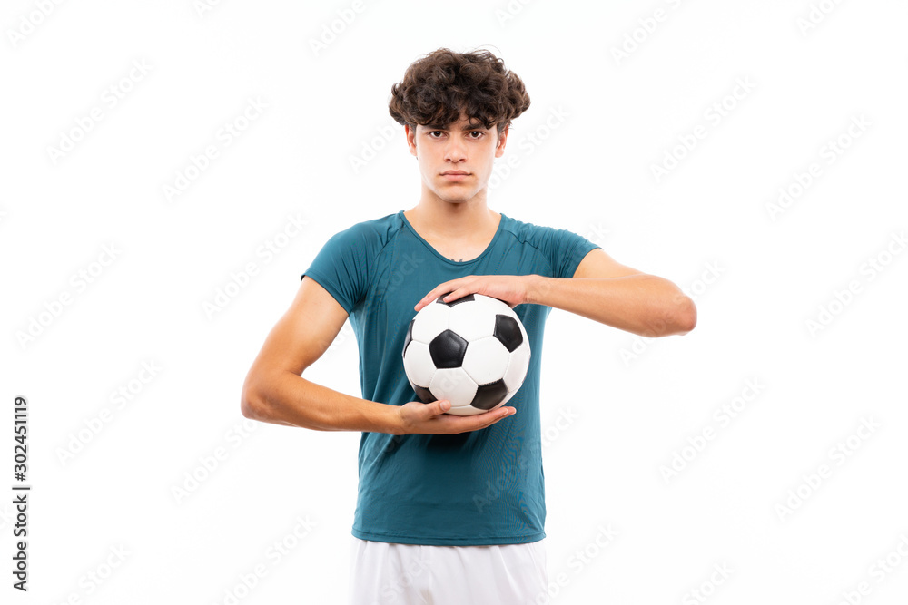 Young football player man over isolated white wall