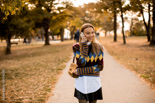 Pretty young woman walking ...