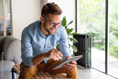 Young Man holding digital tablet 