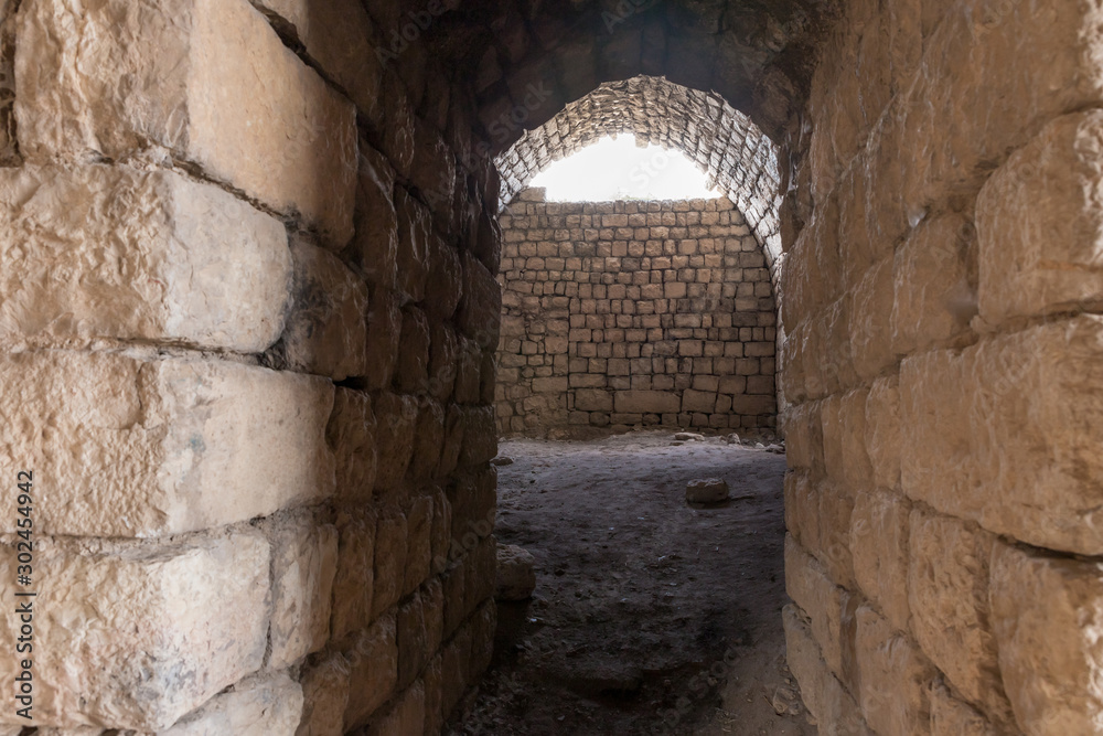Fototapeta premium Passage between the halls in ruins of crusader Fortress Chateau Neuf - Metsudat Hunin is located at the entrance to the Israeli Margaliot village in the Upper Galilee in northern Israel