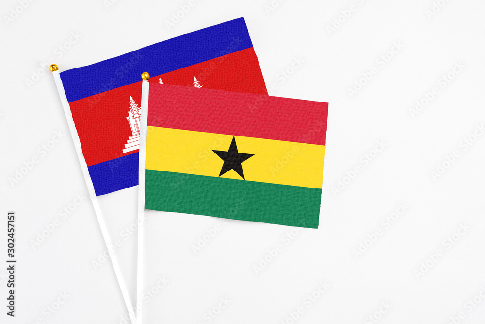 Ghana and Cambodia stick flags on white background. High quality fabric, miniature national flag. Peaceful global concept.White floor for copy space. Ghana and Cambodia stick flags on white background. High quality fabric, miniature national flag. Peaceful global concept.White floor for copy space.