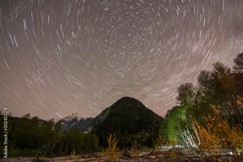 North star/polaris with star trails and mountain landscape in Squamish, British Columbia, Canada
