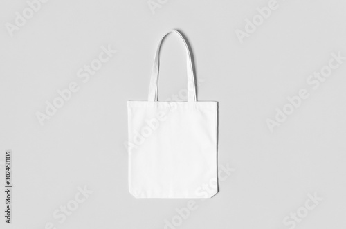 White tote bag mockup on a grey background. photo