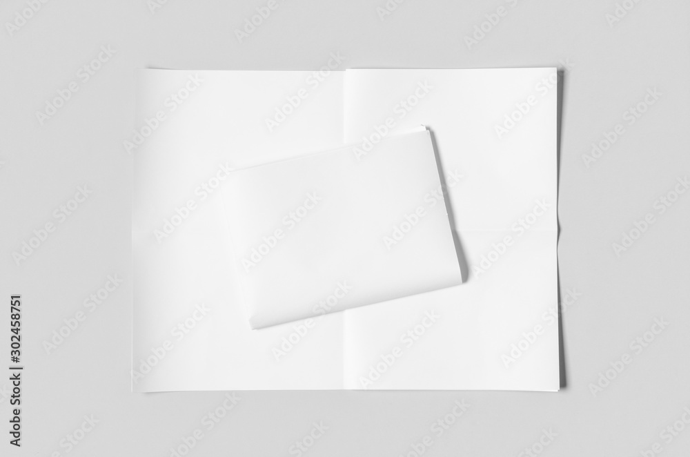 Blank newspaper mockup on a grey backgound.