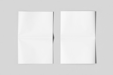 Blank newspaper mockup on a grey backgound.