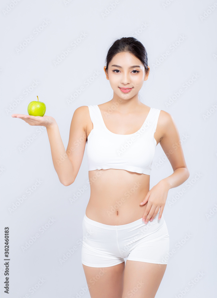 Portrait asian woman smiling holding green apple fruit and beautiful body diet with fit isolated on white background, girl weight slim with cellulite or calories, health and wellness concept. Portrait asian woman smiling holding green apple fruit and beautiful body diet with fit isolated on white background, girl weight slim with cellulite or calories, health and wellness concept.
