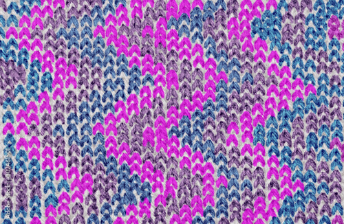 background pattern of knitted pattern of threads of different colors for winter things