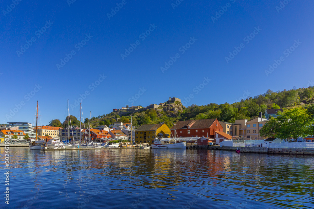 Halden waterfront during sunny, summer day with the Fredriksten fortress as the backdrop. Ostfold County, Norway.
