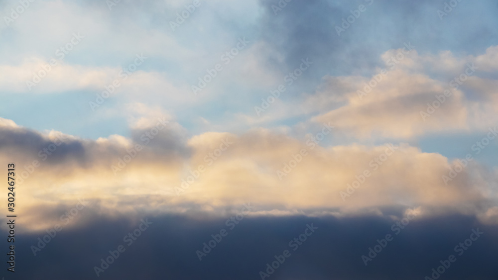 Dark dramatic clouds during sunset, background for design_