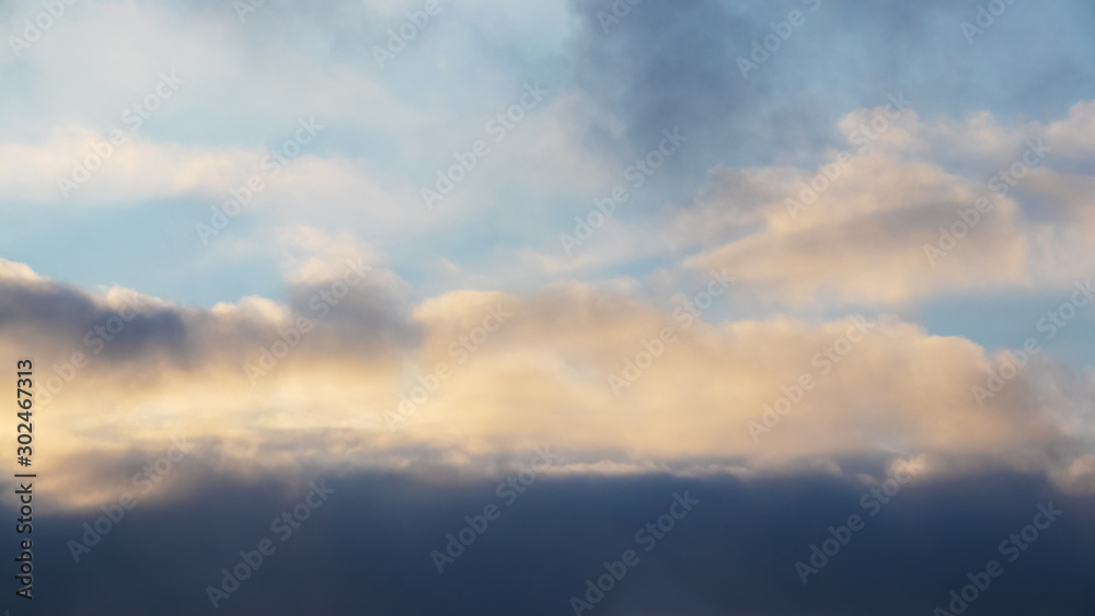 Dark dramatic clouds during sunset, background for design_ Dark dramatic clouds during sunset, background for design_