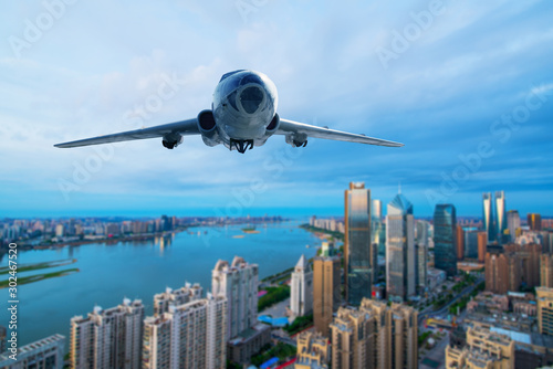 Commercial airplane jetliner flying above center of London. Travel and business. photo