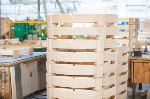 Woodworking industry. Making wooden saunas. Harvesting a wooden barrel in the workshop