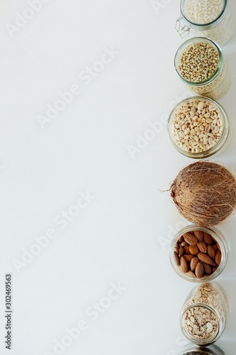 Various raw cereals, grains in glass jars. The concept of zero waste, food storage in the kitchen, healthy nutrition. Top view with copy space for text.