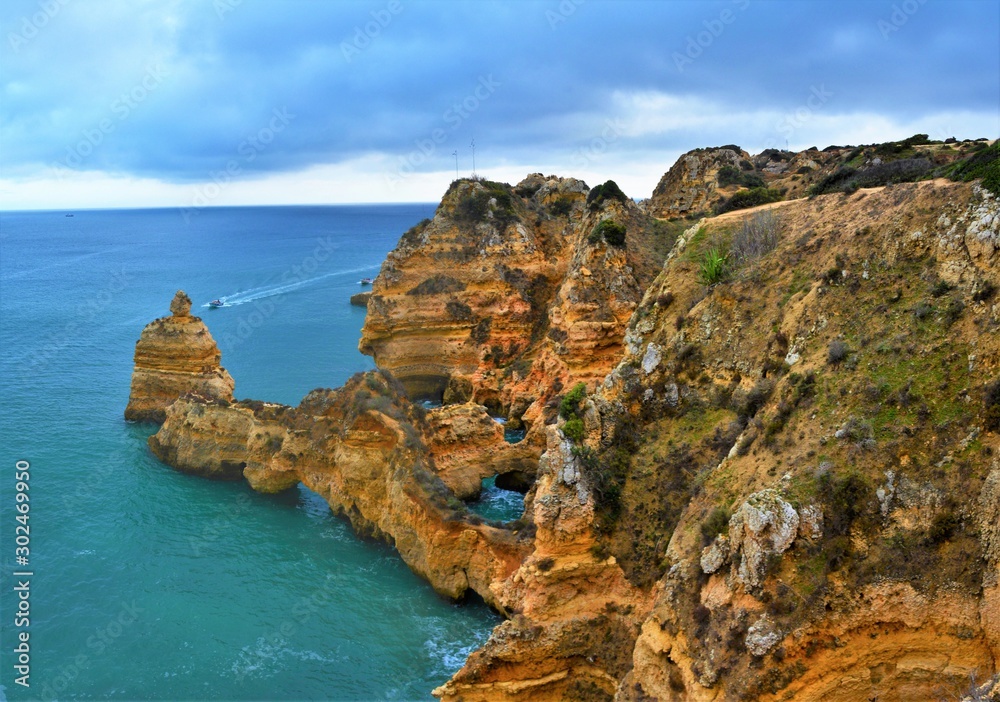 Rocky beach in Lagos - Portugal on a cloudy day 31.Oct.2019