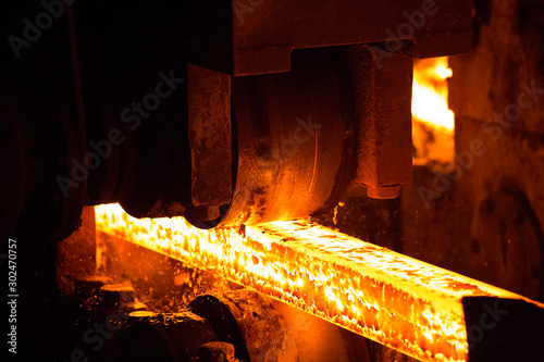 Steel slab being rolled on the Hot strip mill at Demra, Dhaka, Bangladesh photo