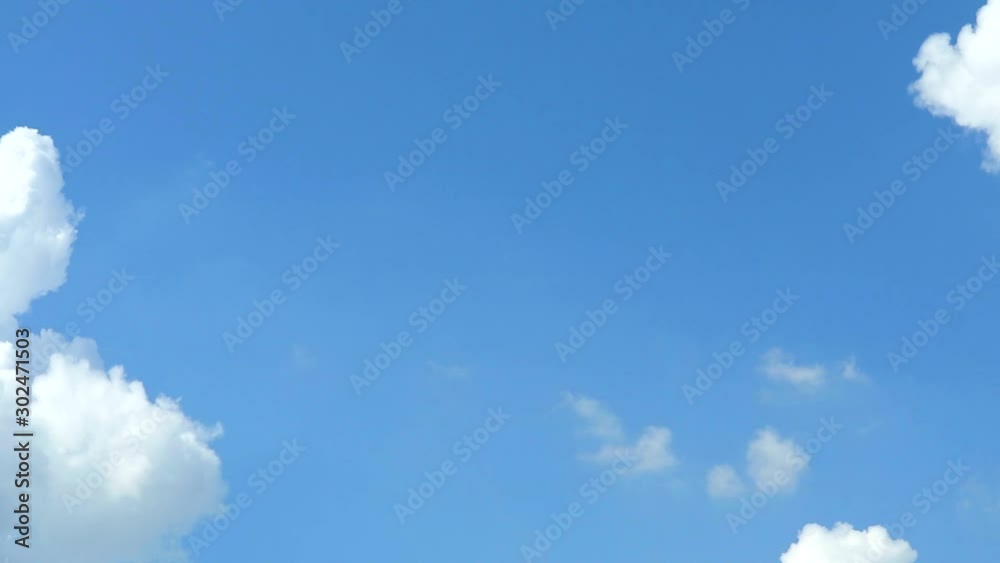 pure clear blue sky background and slow white heap cloud moving by wind