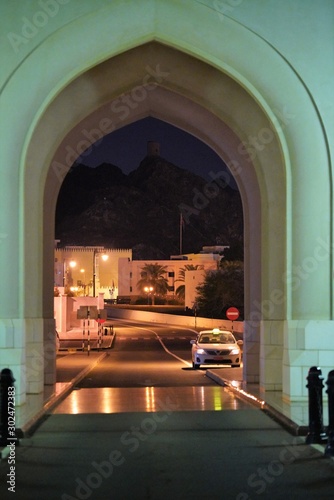 nighr view on stone arch in downtown of Muscat city photo