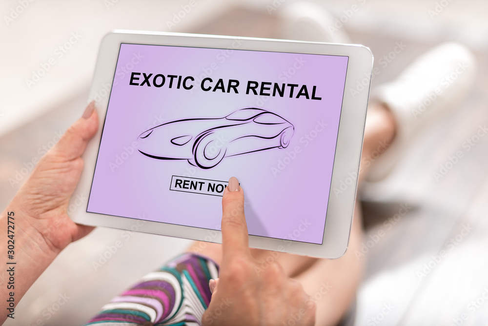Exotic car rental concept on a tablet Exotic car rental concept on a tablet