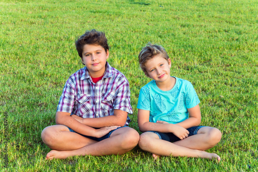 Two boys - brothers are resting Two boys - brothers are resting