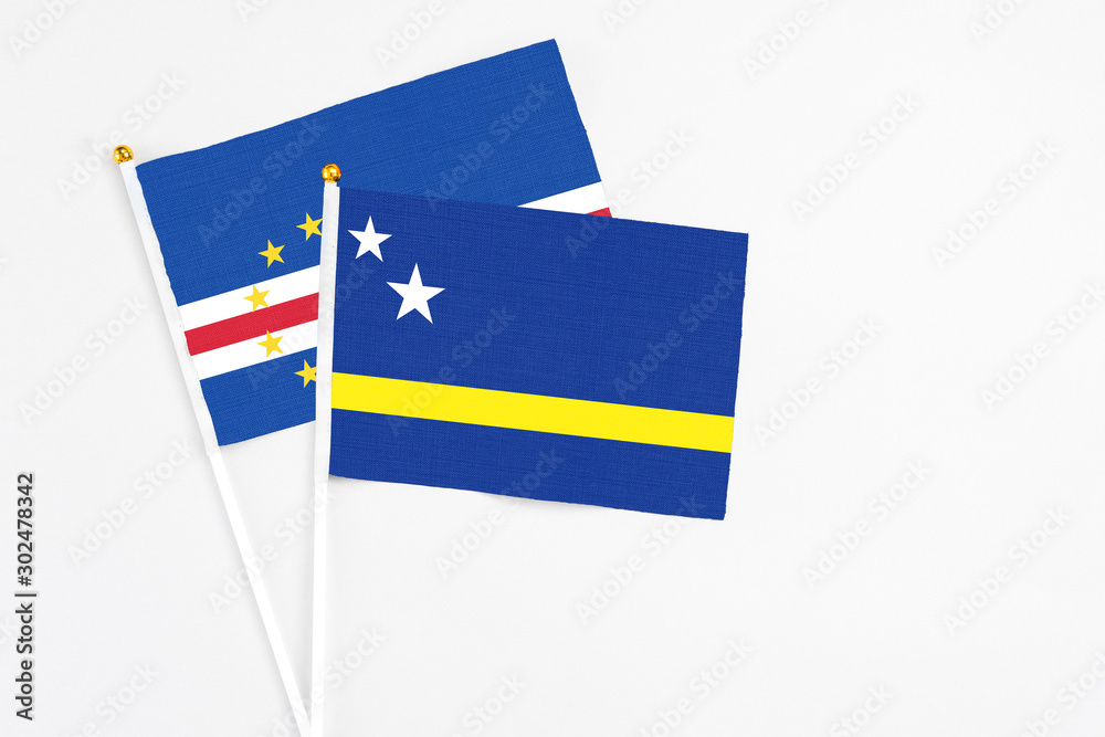 Curacao and Cape Verde stick flags on white background. High quality fabric, miniature national flag. Peaceful global concept.White floor for copy space. Curacao and Cape Verde stick flags on white background. High quality fabric, miniature national flag. Peaceful global concept.White floor for copy space.