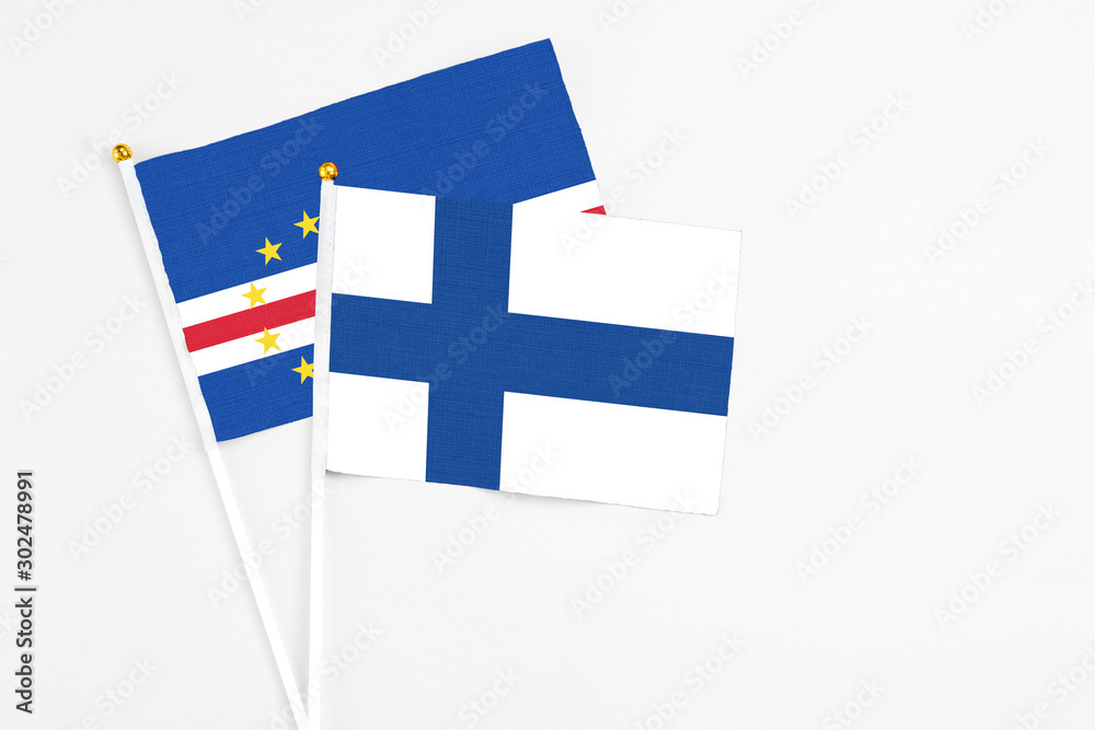 Finland and Cape Verde stick flags on white background. High quality fabric, miniature national flag. Peaceful global concept.White floor for copy space.