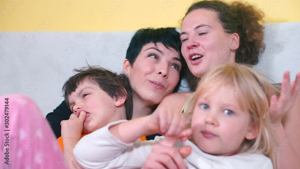 Portrait of a same-sex family. Self-isolation at home, during quarantine of coronavirus infection COVID-19. Portrait of a same-sex family. Self-isolation at home, during quarantine of coronavirus infection COVID-19.